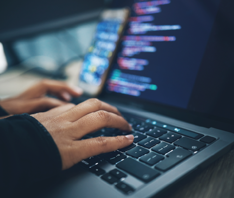Person typing on a computer.